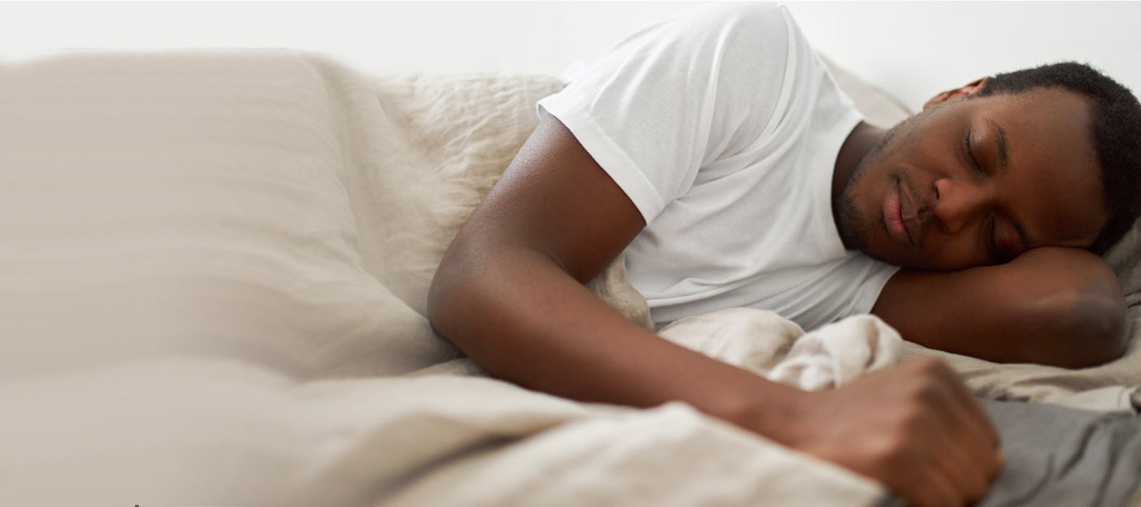 man sleeping in bed