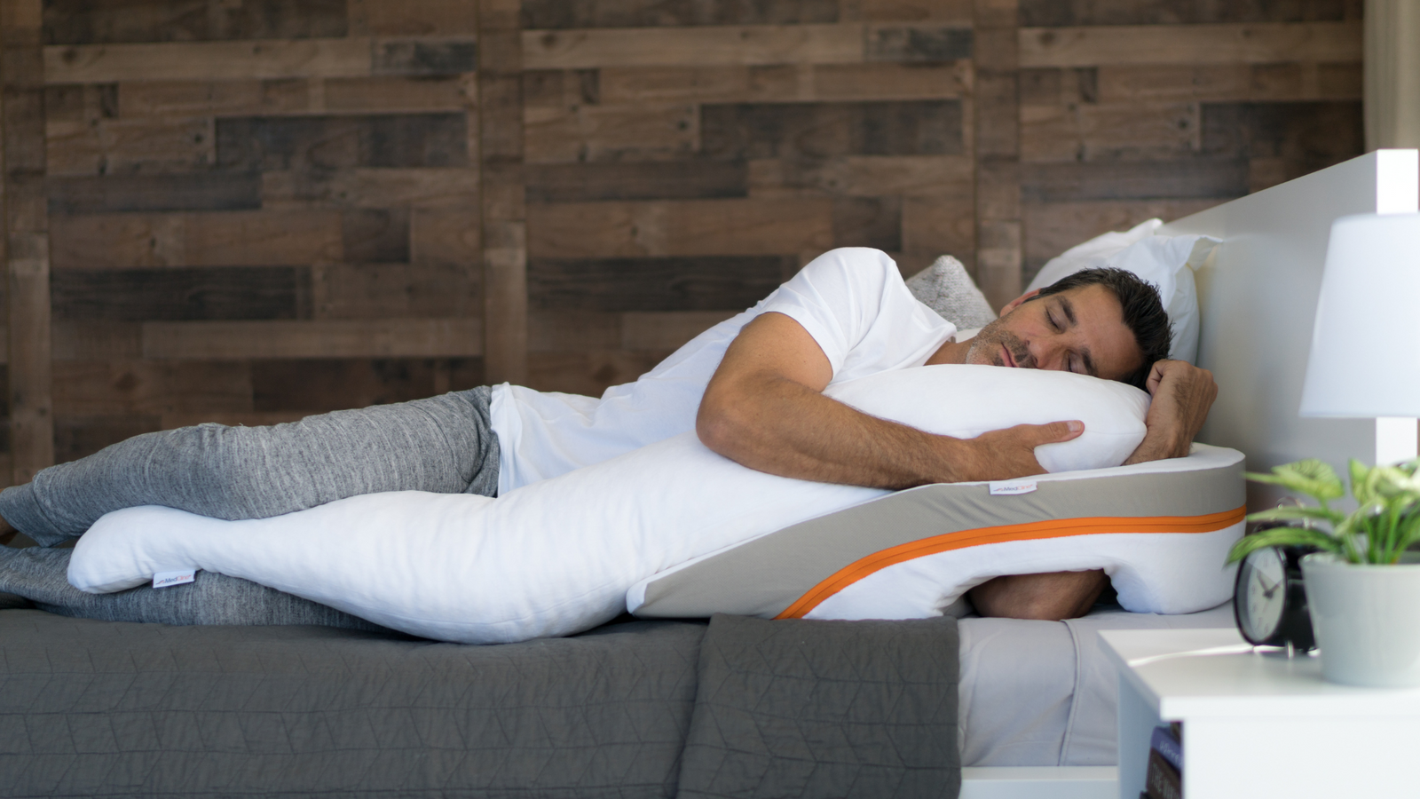 man sleeping on the medcline reflux relief system for positional therapy