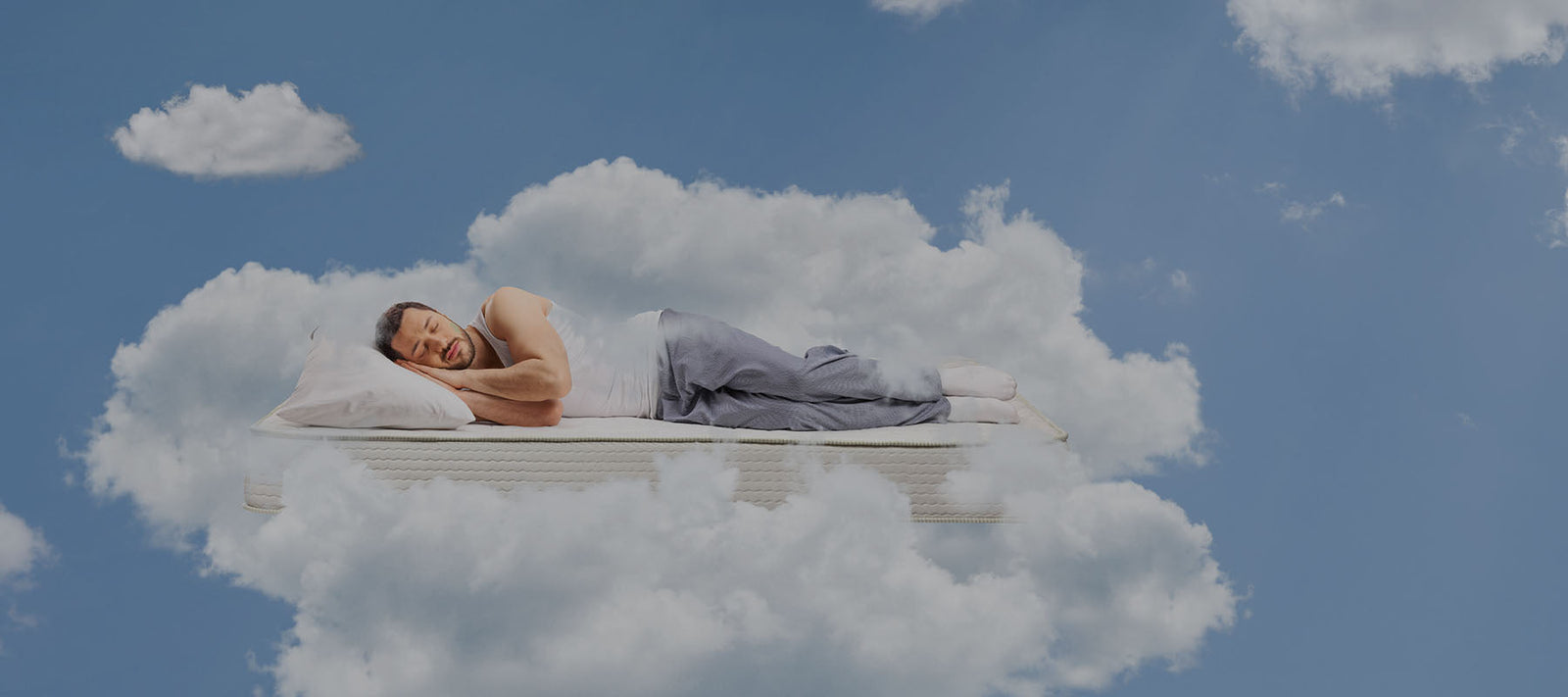 man sleeping on clouds