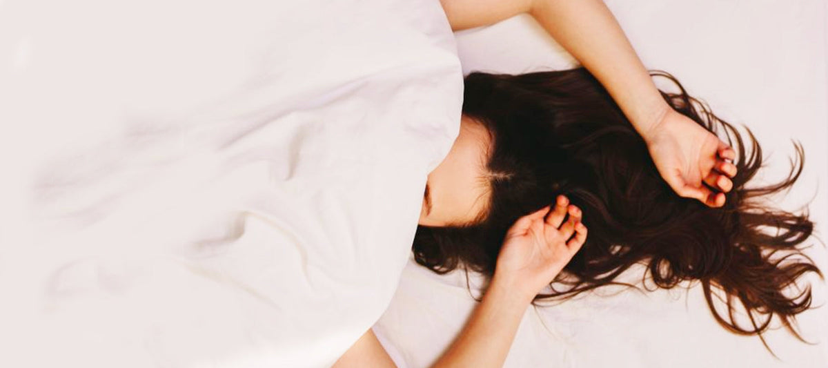 woman under the bed cover