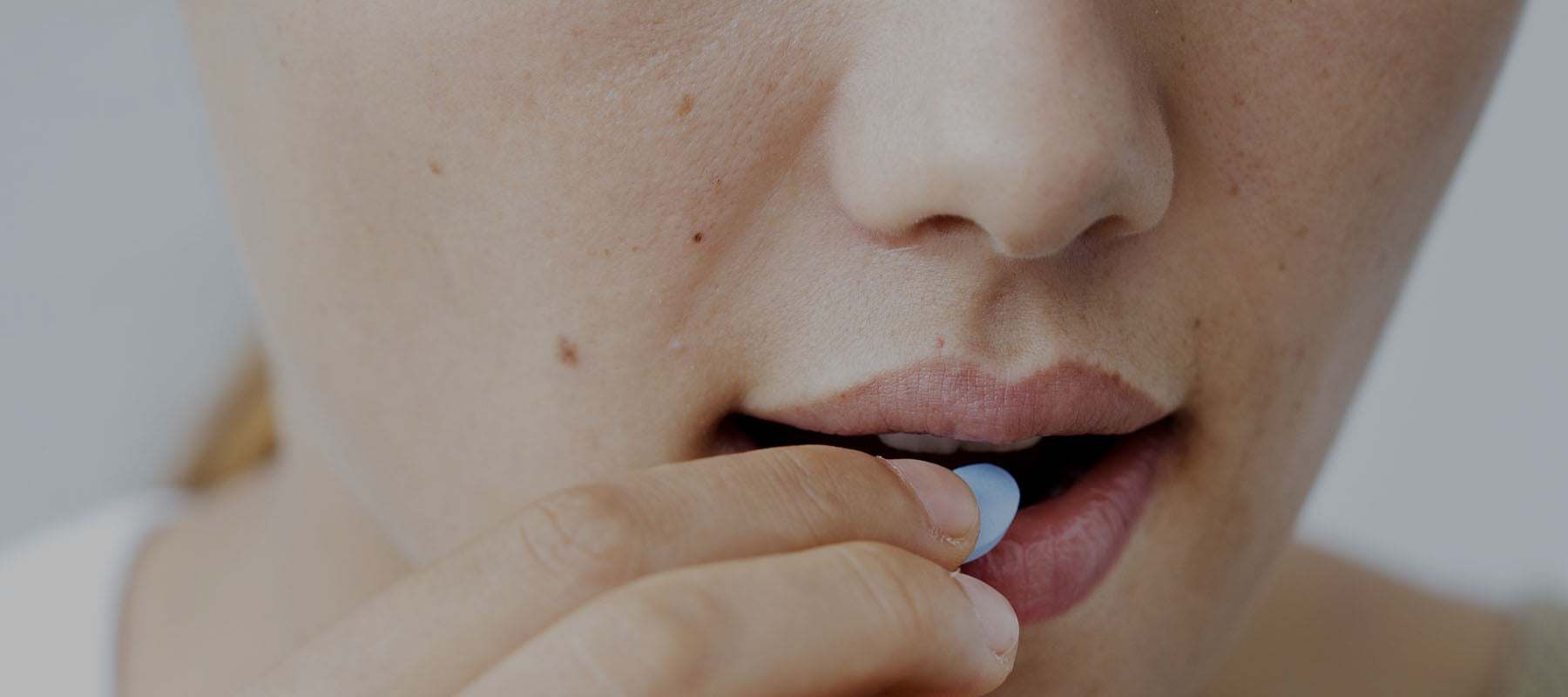 Woman using medication for acid reflux