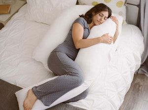woman sleeping with the therapeutic body pillow